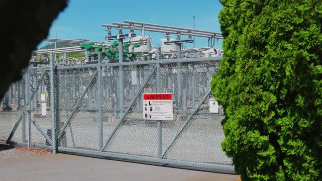 Electrical substation security sliding gate with warning safety sign