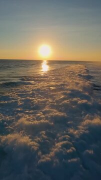 Vertical video. Cinematic Flight Above Darkening Waves at Nyang Nyang Beach, Blue Hour Ocean Atmosphere And Remote Tropical Coastline After Sunset