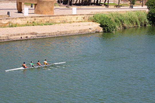People canoeing on the Guadalquivir River in Seville city