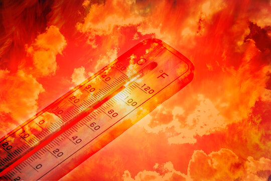 Thermometer showing high temperature against fiery hot sky, symbolizing climate change and heatwave.