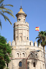 Obraz premium The Tower of Gold (Torre del Oro watchtower) next to The Guadalquivir river in Seville city