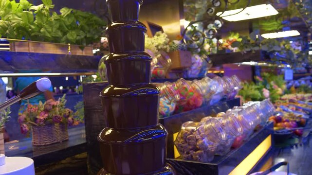 Sweet buffet with chocolate fountain at restaurant