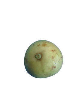 Fresh round yellow longan fruit on a simple surface