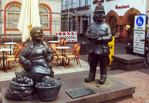 Koblenz, Germany Bronze sculpture - Market Woman and Policeman located in the square. The figures depict a market woman named Ringelstein and a policeman named Otto, representing folklore characters