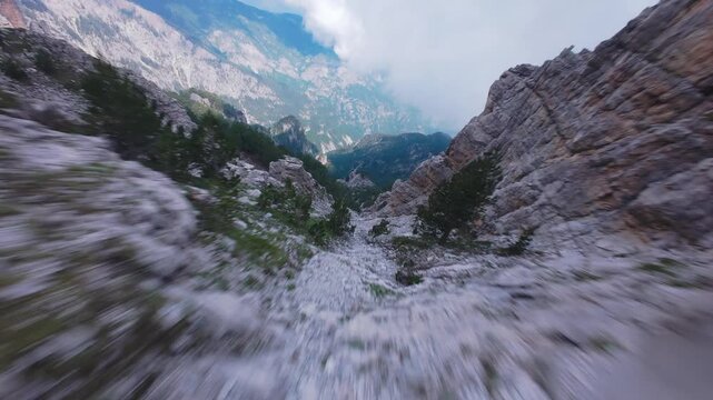 Dynamic FPV drone shot diving along sharp crest of Mount Olympus Greece