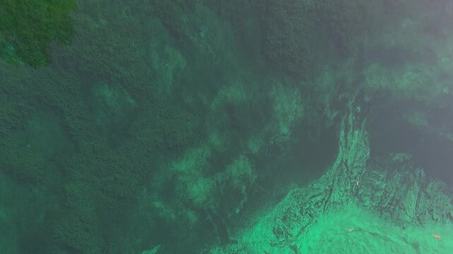 Underwater Freshwater Spring Gushing from Limestone Bed at Kitch-iti-kipi. Top-Down View of Underground Water Erupting through Green Aquifer Sand. 