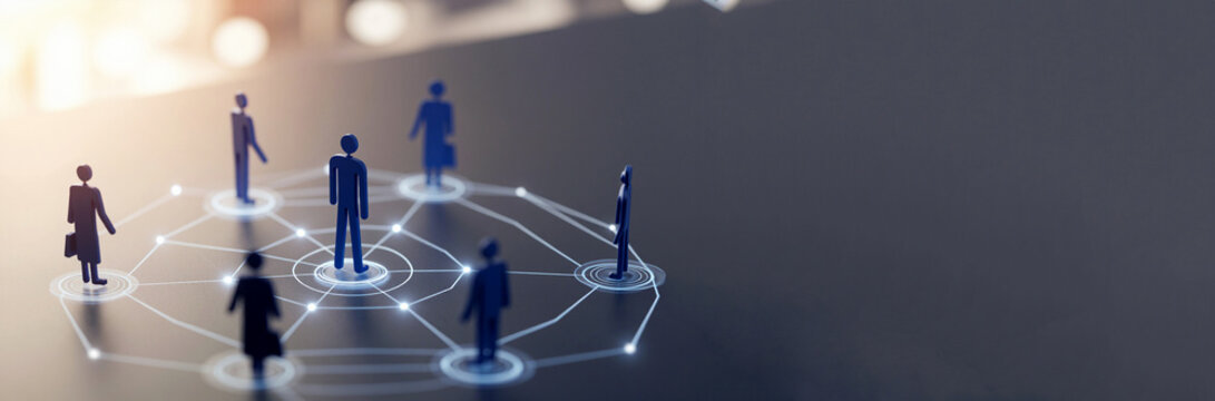 Conceptual image of a professional social and business network with stylized blue figures connected by a digital hub and spokes pattern on a dark reflective surface