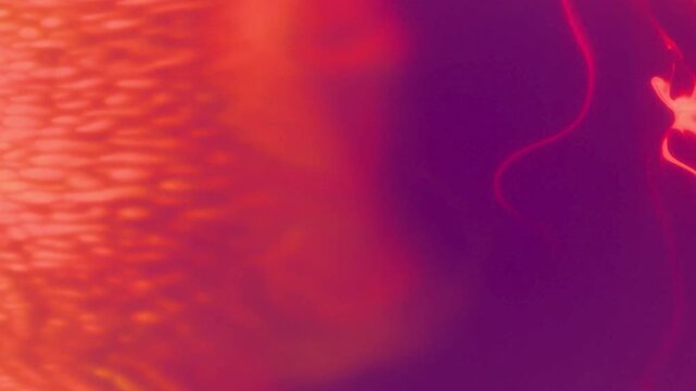 Warm colorful nebula ink reaction background. Cosmos galaxy universe paint stain texture 4K RED camera. High quality video.