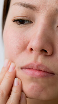 Jaw pain jaw clench face massage masseter muscle cheek skin lower face pain relief close up human skin fingers touch