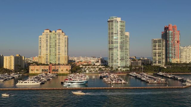 Miami marina with luxury yacht. Summer sunset vacation. Luxury South beach marina. Luxury yacht. Miami south beach view. Yacht club. Marina in Miami, Florida on sunset. Coastal marina skyline