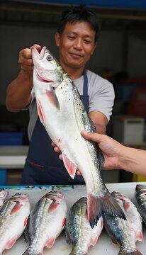Fish seller proudly holding fish, professional, showing fresh catch against a market backdrop
