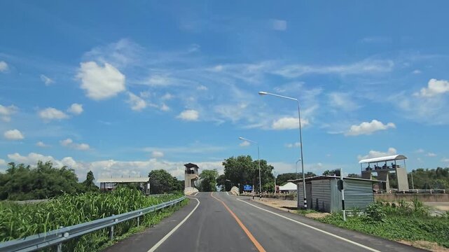 Driving on country road in rural, Singburi province Thailand.