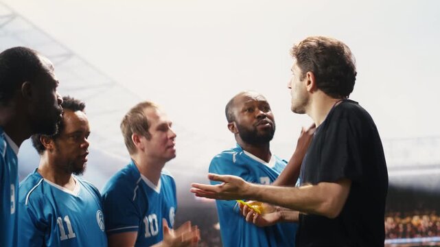 Soccer referee stopping heated argument with yellow card raised, giving warning for violent rules violation and unsportsmanlike conduct.
