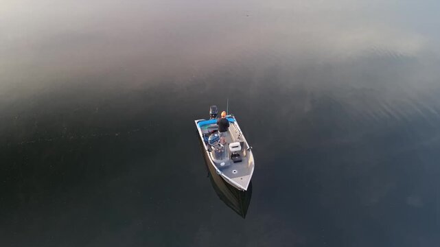 Catching a Large Mouth Bass on Egg Pond in Lincoln, Maine On a Calm and Quiet Summer Morning 