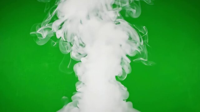 Cinematic white cooking smoke rising and swirling in slow motion against a bright green screen background for visual effects compositing