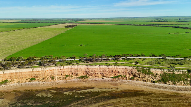 Port Julia, Yorke Peninsula, South Australia &ndash; 4K aerial drone view of limestone cliffs, old coast road, surrounding farmland, and Gulf St Vincent.