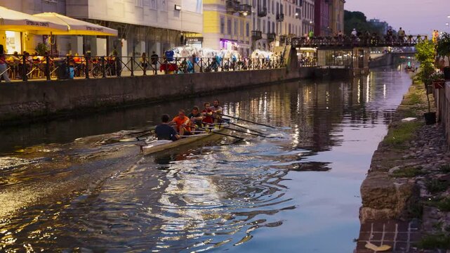 Rowing team in Navigli canal in Milan italy