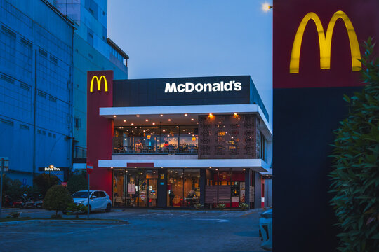 Illuminated McDonald's Fast Food Restaurant Building at Twilight