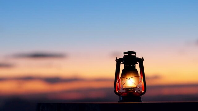 A glowing vintage lantern at dusk, symbolizing hope, faith, and inner light. A calm, spiritual image of peace and light overcoming darkness.