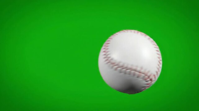 Isolated white baseball spinning and flying through the air against a bright chroma key green screen background