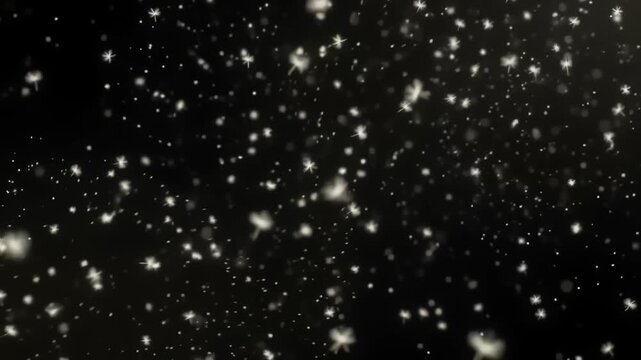 Tiny glowing white pollen particles drifting in air on black background.