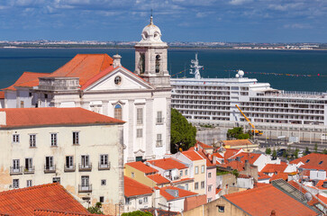 Fototapeta premium Historic church and cruise ship on the Tagus River in Lisbon, Portugal