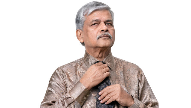 Confident Senior Indian Businessman Adjusting His Tie Isolated