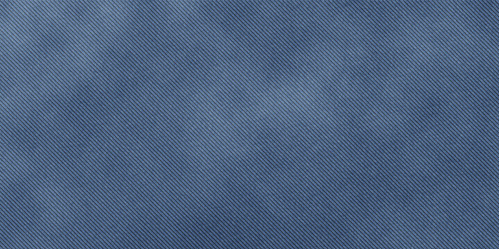 Closeup of indigo blue twill denim fabric texture with diagonal weave pattern material background