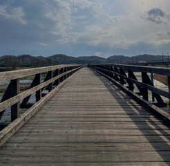 Naklejka premium wooden bridge over the sea