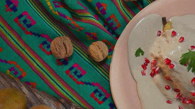 Authentic nuez de castilla and chile en nogada, traditional festive mexican cuisine close up