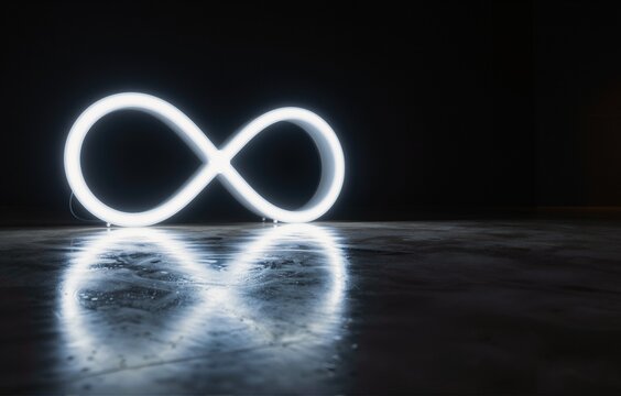 Glowing white neon infinity symbol on dark wet reflective floor