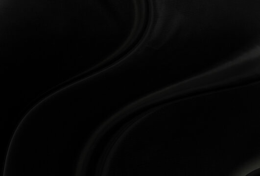 Black gray satin dark fabric texture luxurious shiny that is abstract silk cloth panorama background with patterns soft waves blur beautiful.