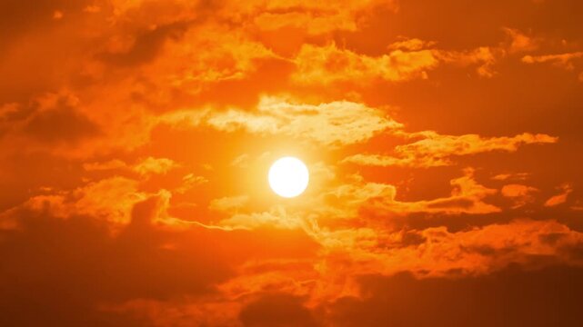 Peaceful sunrise time-lapse with warm golden light and fast-moving clouds.