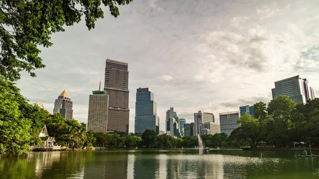 Time-lapse of Bangkok cityscape transitioning from sunny afternoon to magical blue hour.