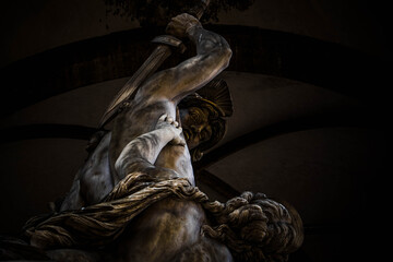 Classic Stone Statue Depicting a Warrior Striking with a Sword under an Open Air Loggia © Nicolas GR