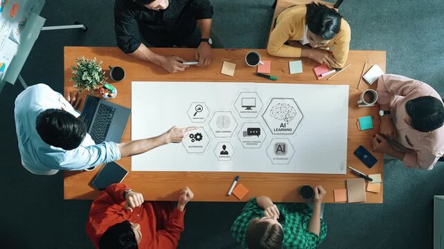 A diverse group of professionals collaborates during a strategic meeting focused on data analysis and AI learning, enhancing innovative solutions and creative problem-solving. Raster