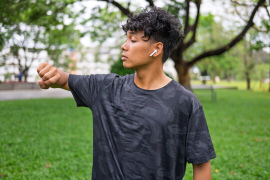 African American mixed race man using smartwatch for fitness tracking and healthy lifestyle.