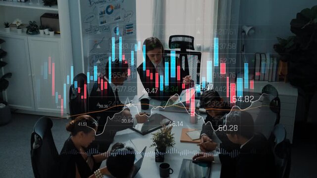 A professional business team collaborates in a modern office setting, analyzing finance data and charts while discussing strategies for growth and success. Raster