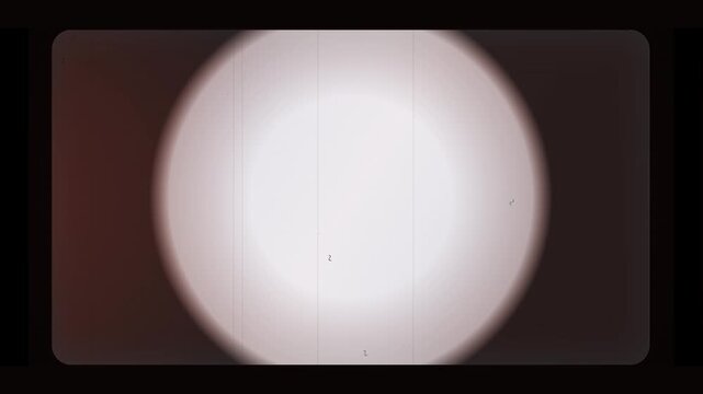 Vintage film reel overlay with light leak and grain, authentic retro cinema texture, perfect for nostalgic video effects