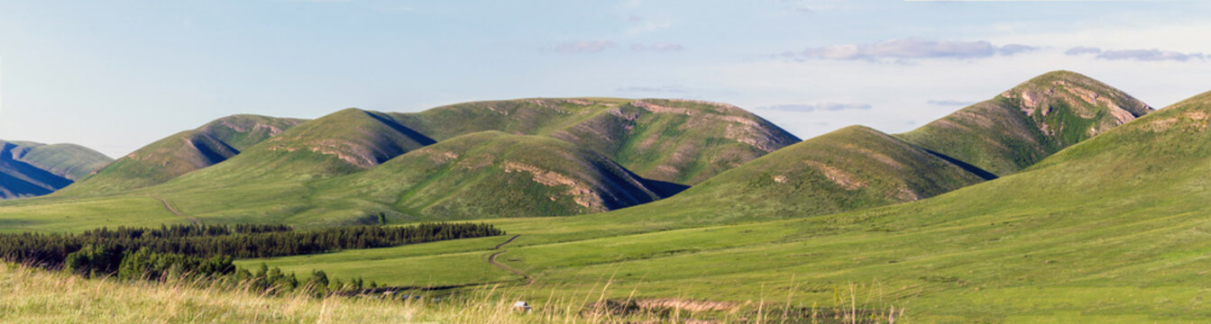 Magnificent landscape of the Karamuruntau ridge at sunset on a spring day