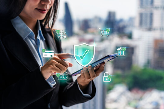 Smiling businesswoman holding a smartphone with virtual green shield checkmark and secure transaction icons, digital cybersecurity concept