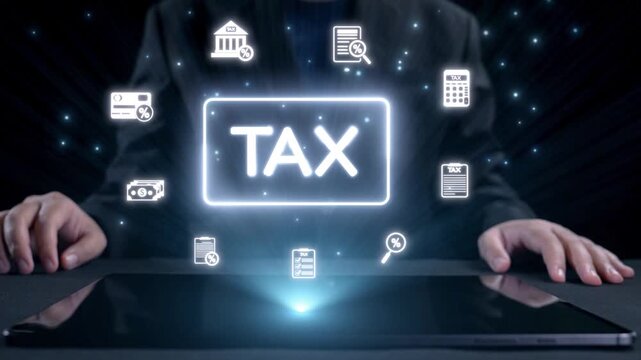 A businessman interacts with a tablet while tax icons appear in a digital format above. This image represents finance, technology, and modern tax management strategies. Qubit