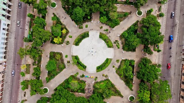 Top-down aerial view of a star-shaped park with radiating pathways in Merida, Yucatan, Mexico, green gardens forming a symmetrical geometric pattern.
