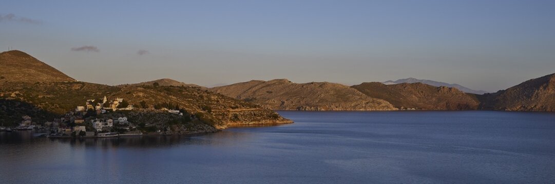 Coastal landscape with a wide view of the sea at sunrise, Symi town, Symi, Dodecanese, Greek Islands, Greece