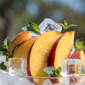 peach slices with ice cubes and mint