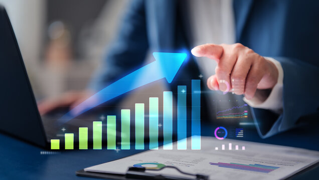 Corporate professionals drive business growth, increase success, and track investment performance achievement by analyzing daily profit data on a digital chart for economic