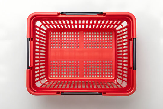 Overhead view of a vibrant red plastic shopping basket on png, shopping basket, red basket, plastic basket, store basket, supermarket basket, shopping container, retail, grocery, market, container