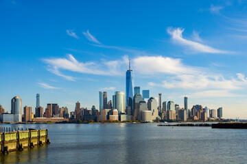 Fototapeta premium New York downtown with tall buildings. New York skyline near Hudson River. New York City panorama and NYC. New York waterfront with skyscraper.