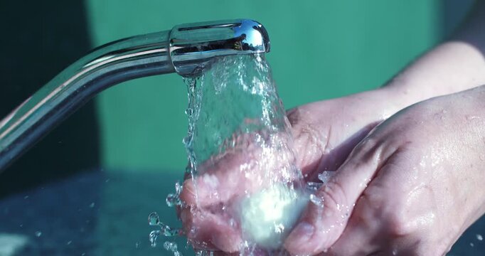 Hand Washing Under Running Water Close Up