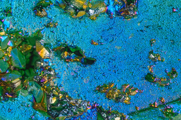 Naklejka premium Close up of colorful crystal and mineral textures with iridescent blue background